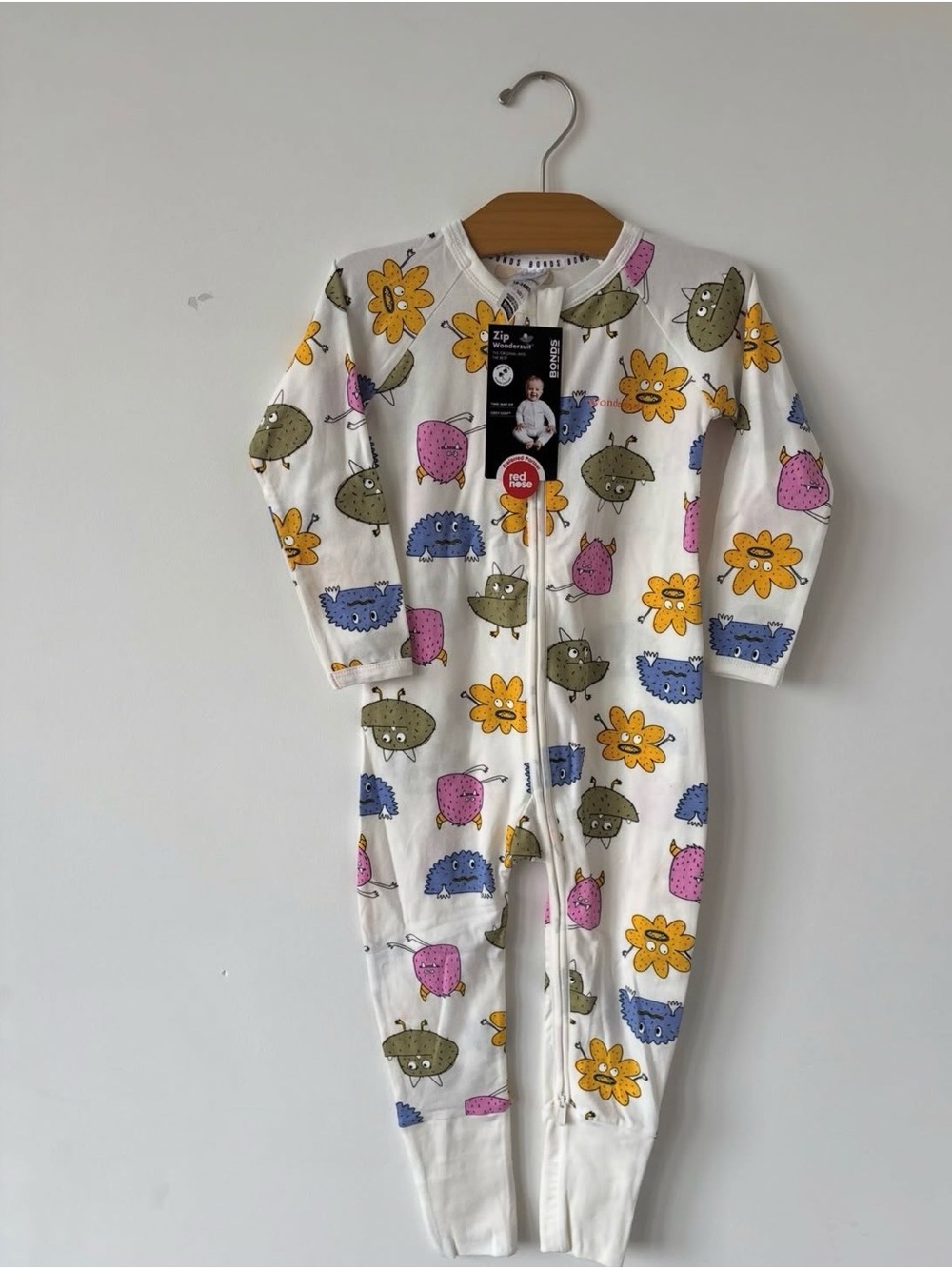 Bonds White Zip-Front Footless Pajamas with Colorful Monster & Flower Print